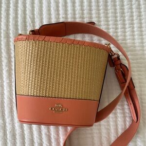 Coach bucket bag with pink accents
